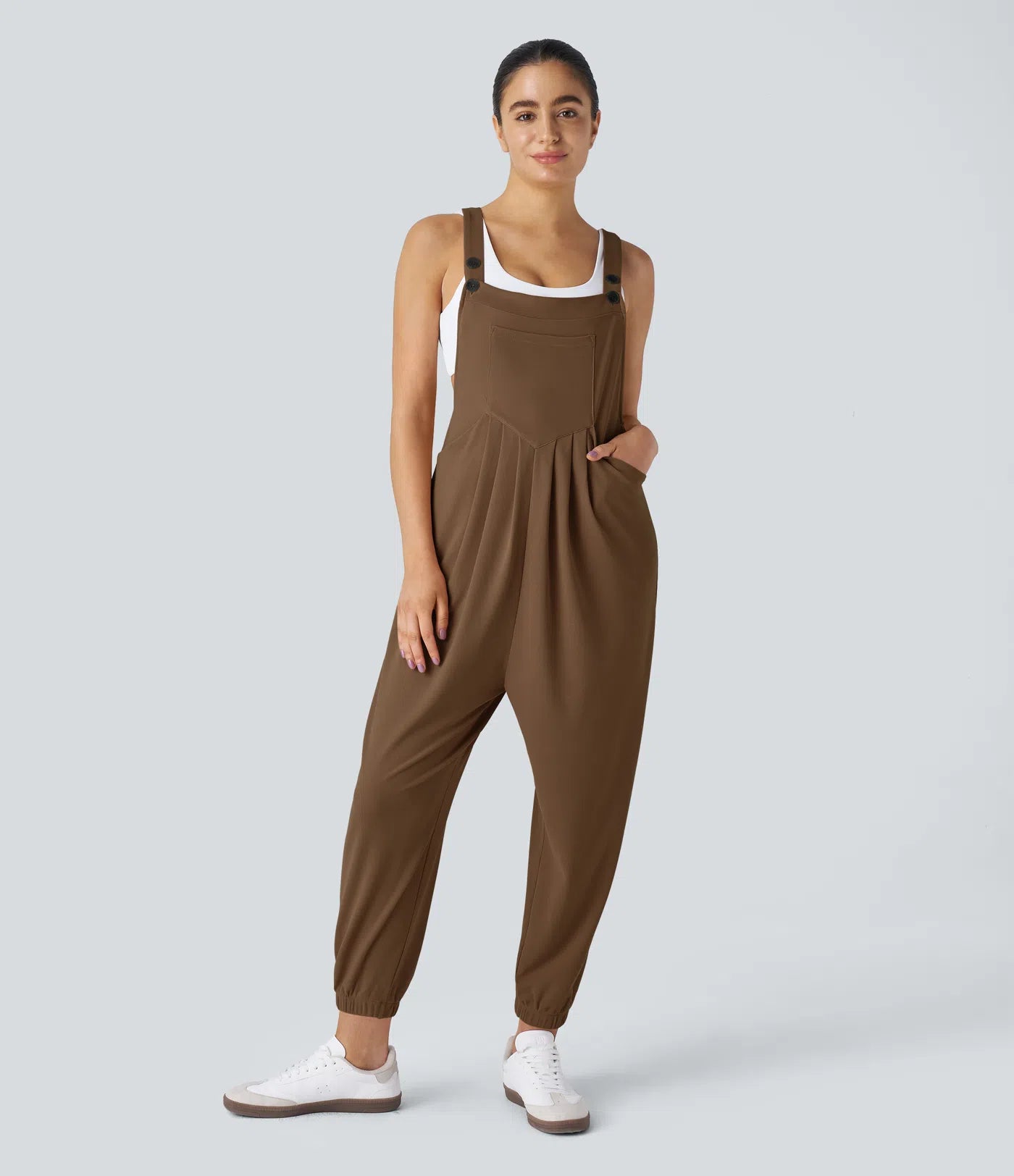 Jogger jumpsuit with adjustable belt and buttons, multiple pockets, and waffle pattern