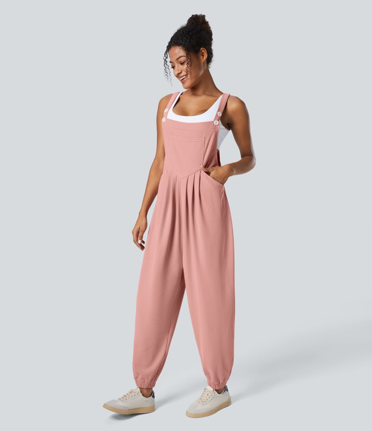 Jogger jumpsuit with adjustable belt and buttons, multiple pockets, and waffle pattern