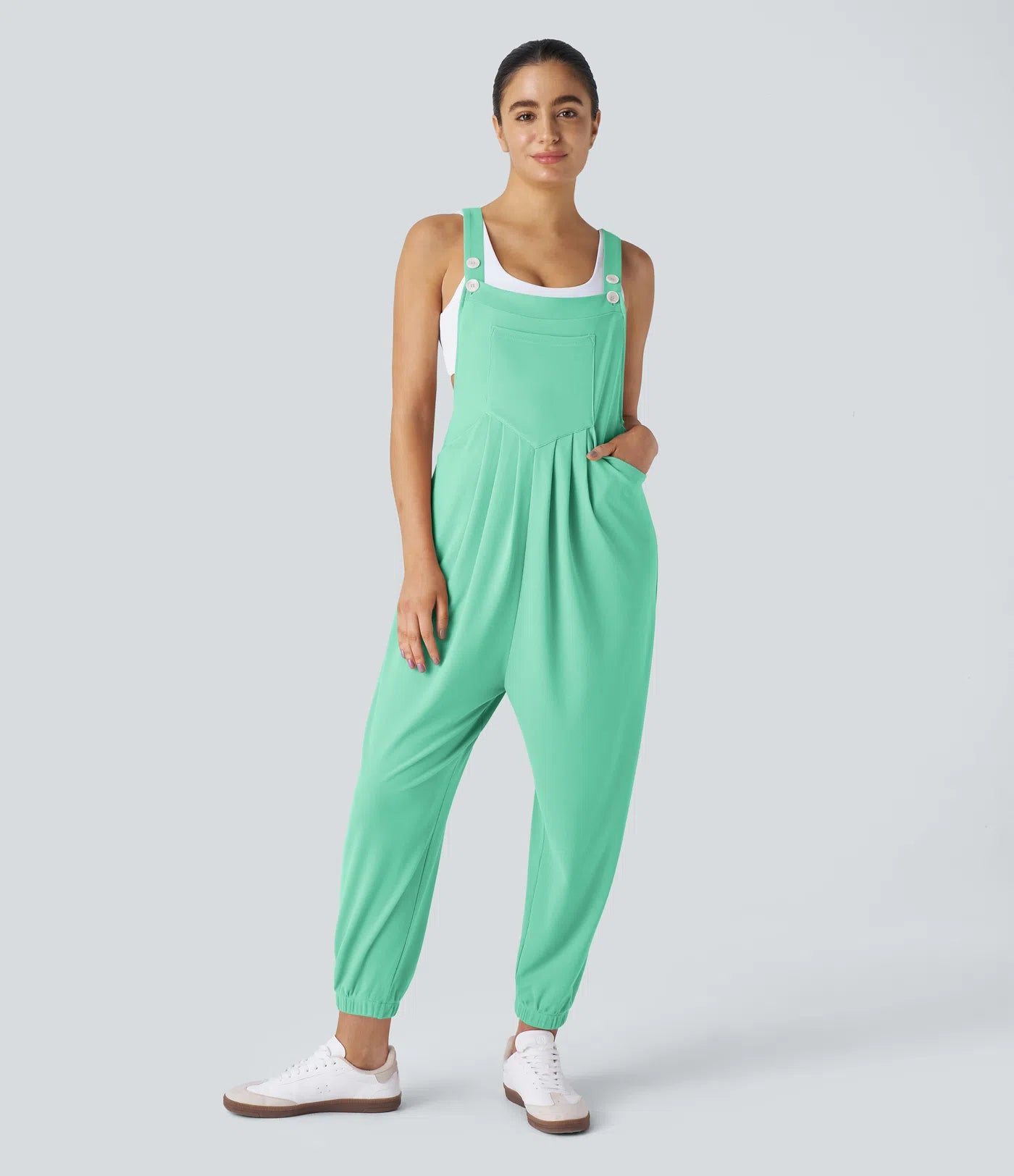 Jogger jumpsuit with adjustable belt and buttons, multiple pockets, and waffle pattern