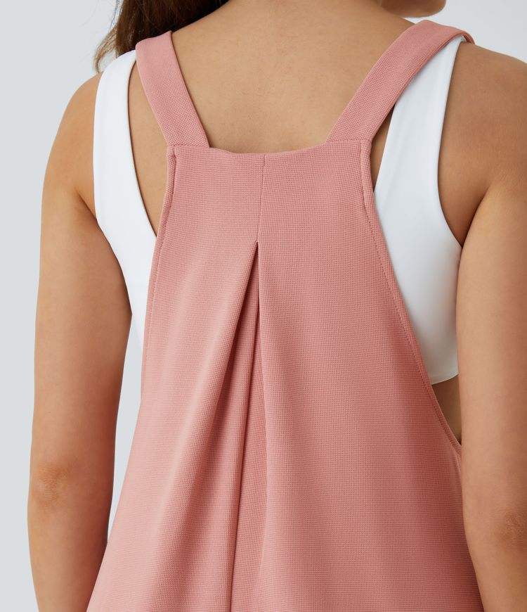 Jogger jumpsuit with adjustable belt and buttons, multiple pockets, and waffle pattern