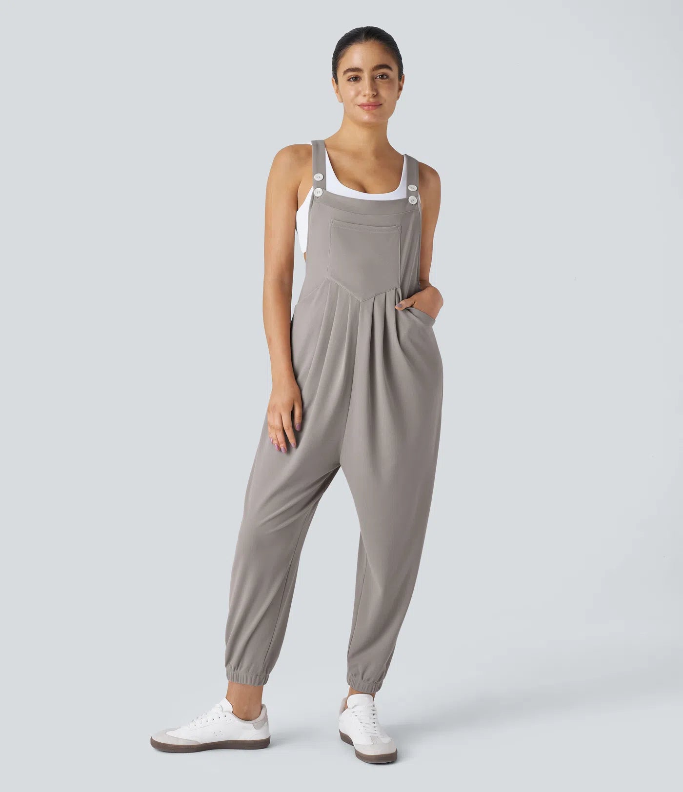 Jogger jumpsuit with adjustable belt and buttons, multiple pockets, and waffle pattern