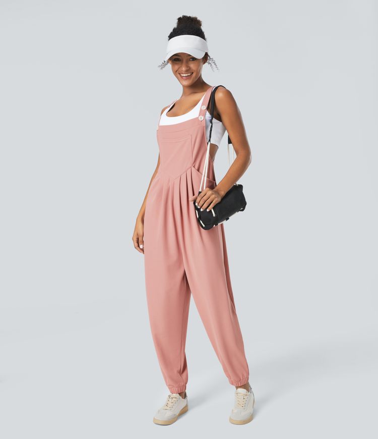 Jogger jumpsuit with adjustable belt and buttons, multiple pockets, and waffle pattern