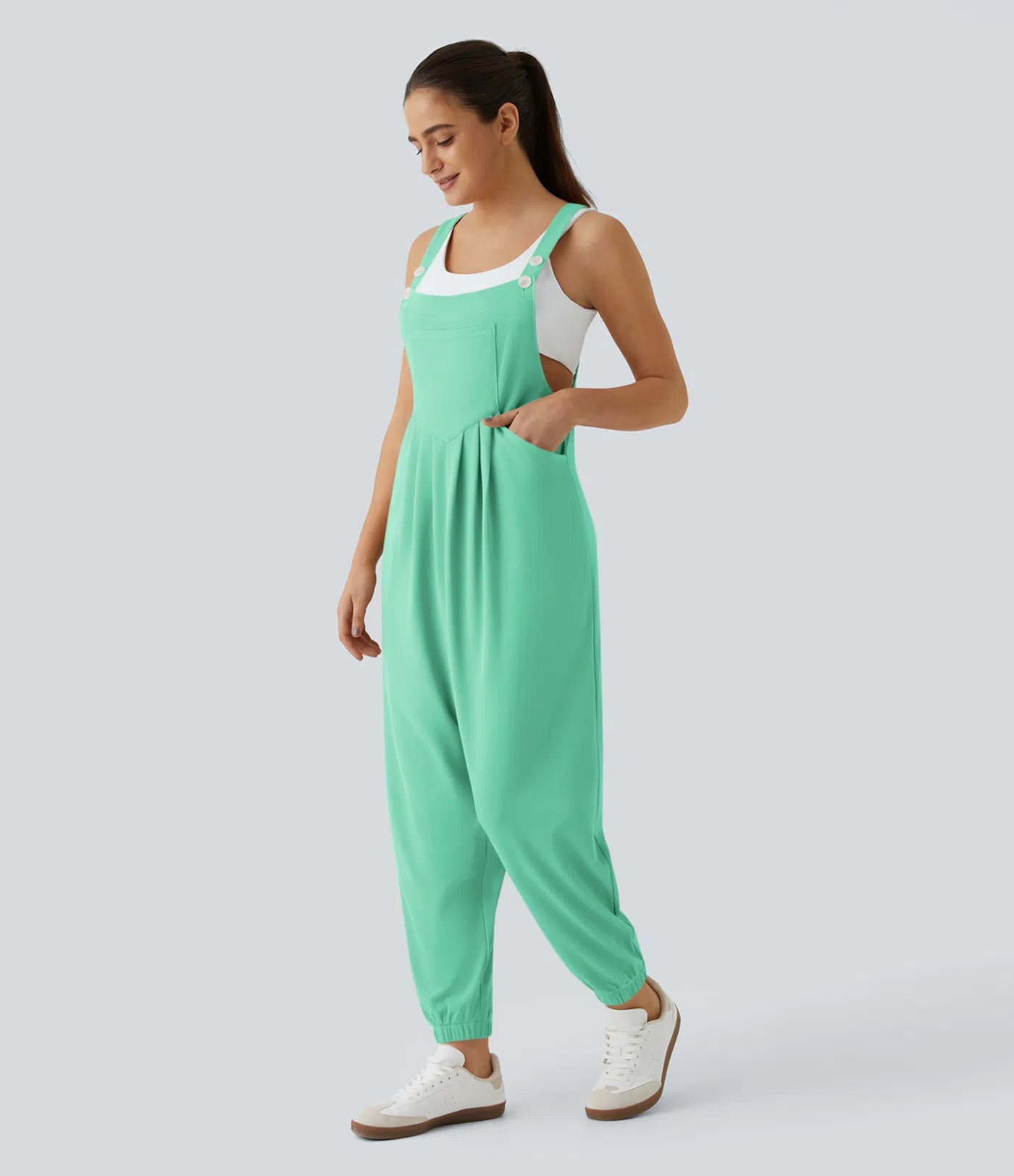 Jogger jumpsuit with adjustable belt and buttons, multiple pockets, and waffle pattern