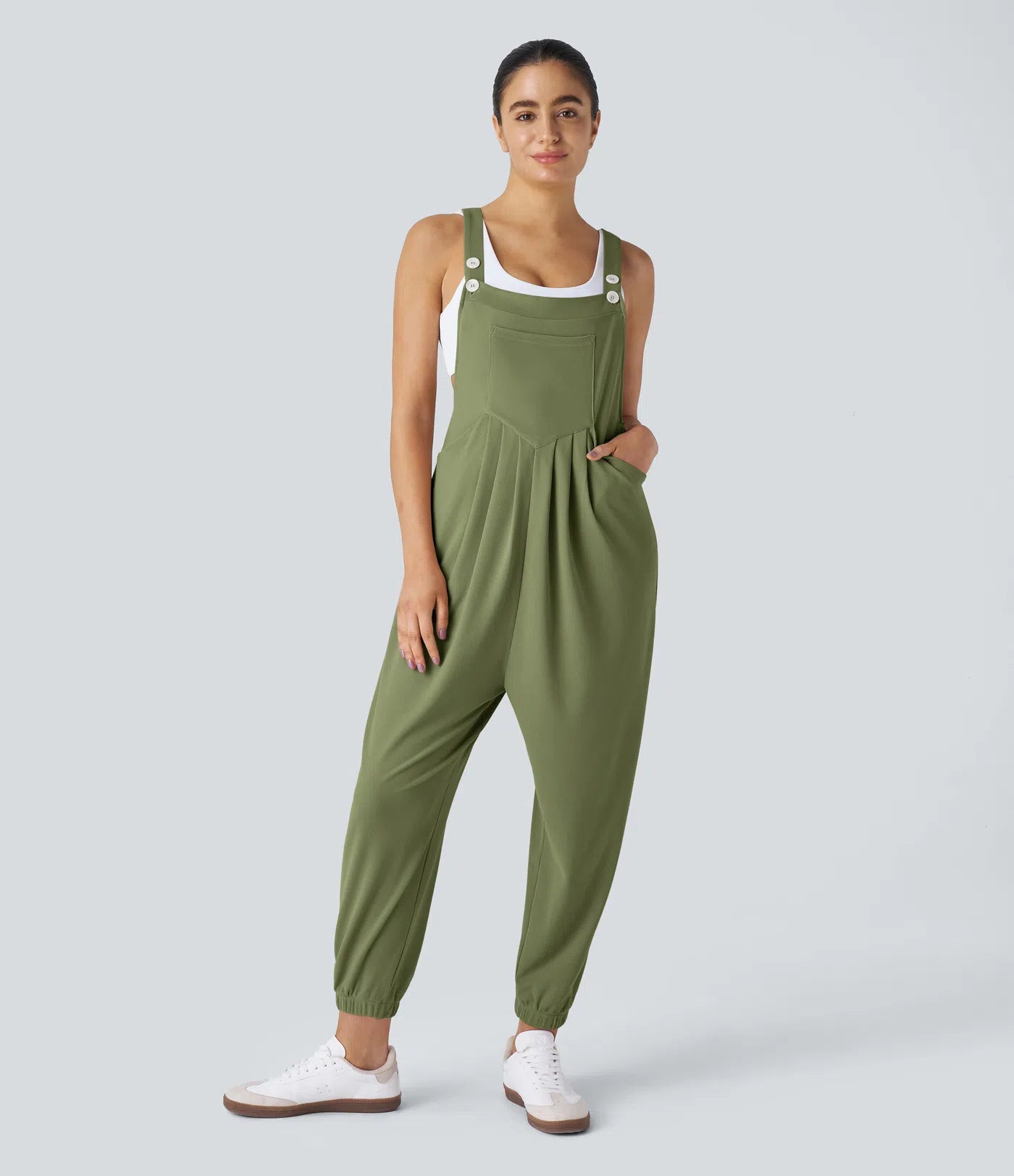 Jogger jumpsuit with adjustable belt and buttons, multiple pockets, and waffle pattern