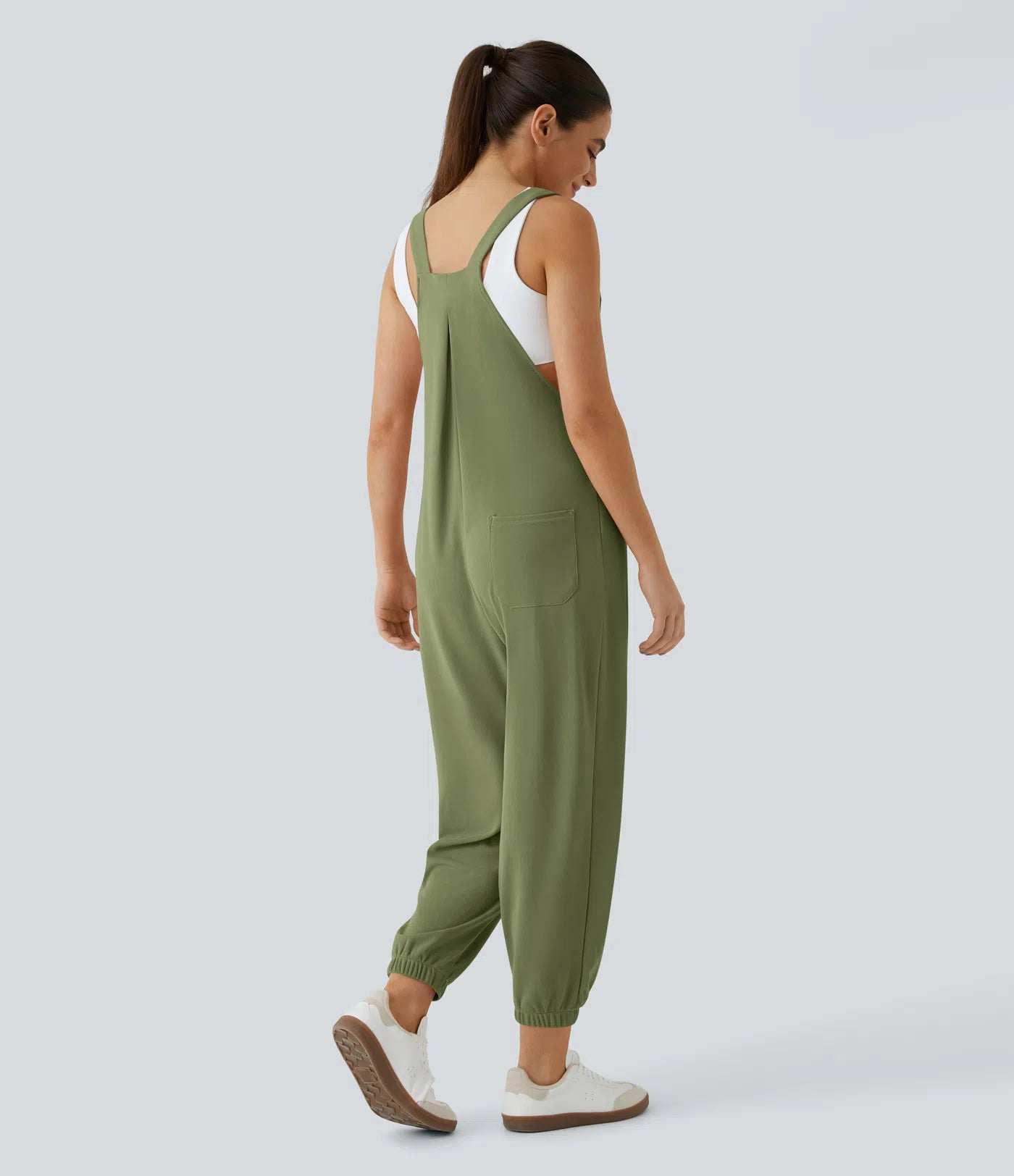 Jogger jumpsuit with adjustable belt and buttons, multiple pockets, and waffle pattern