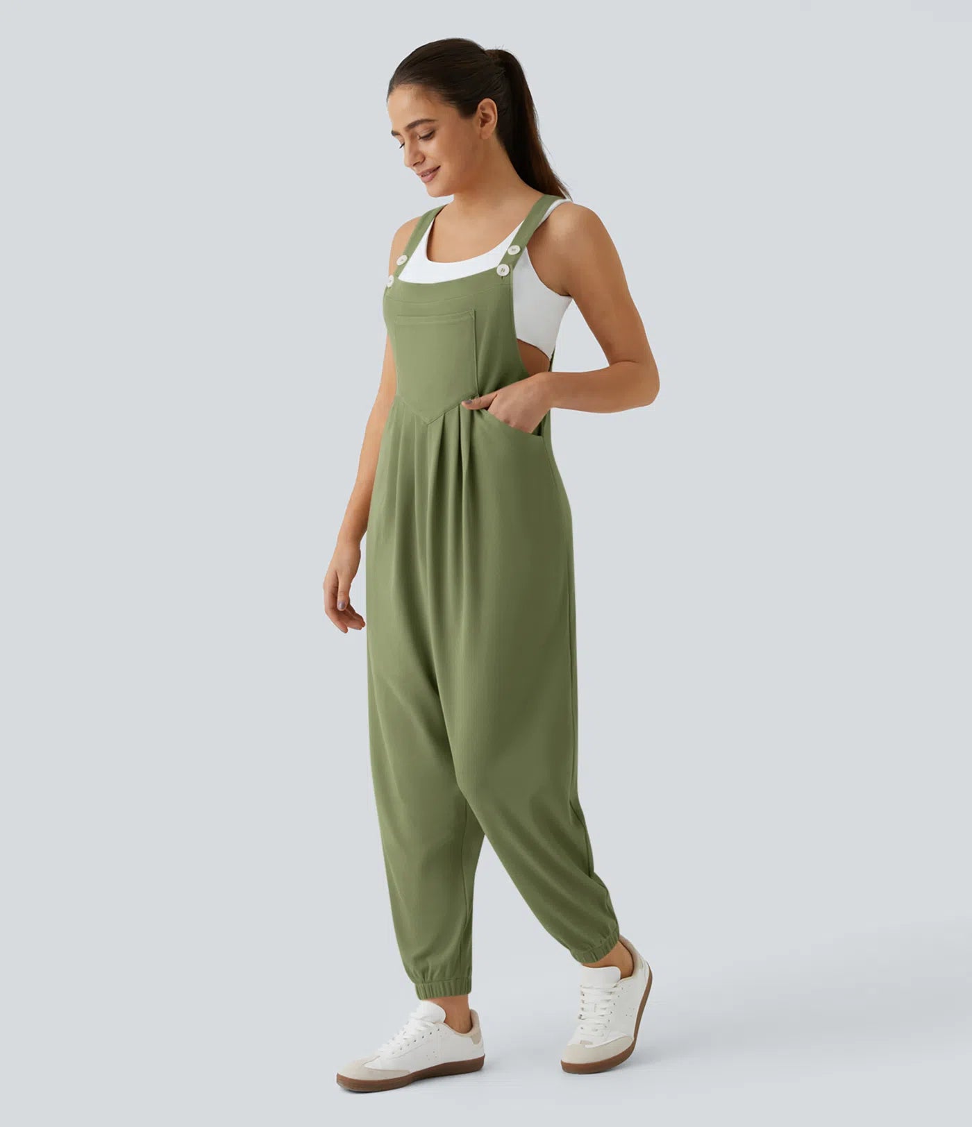 Jogger jumpsuit with adjustable belt and buttons, multiple pockets, and waffle pattern