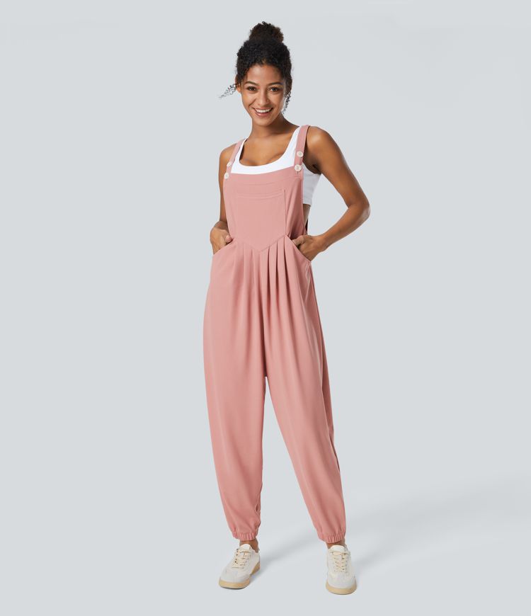 Jogger jumpsuit with adjustable belt and buttons, multiple pockets, and waffle pattern