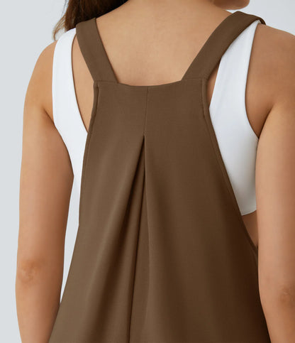 Jogger jumpsuit with adjustable belt and buttons, multiple pockets, and waffle pattern