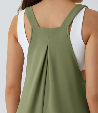 Jogger jumpsuit with adjustable belt and buttons, multiple pockets, and waffle pattern